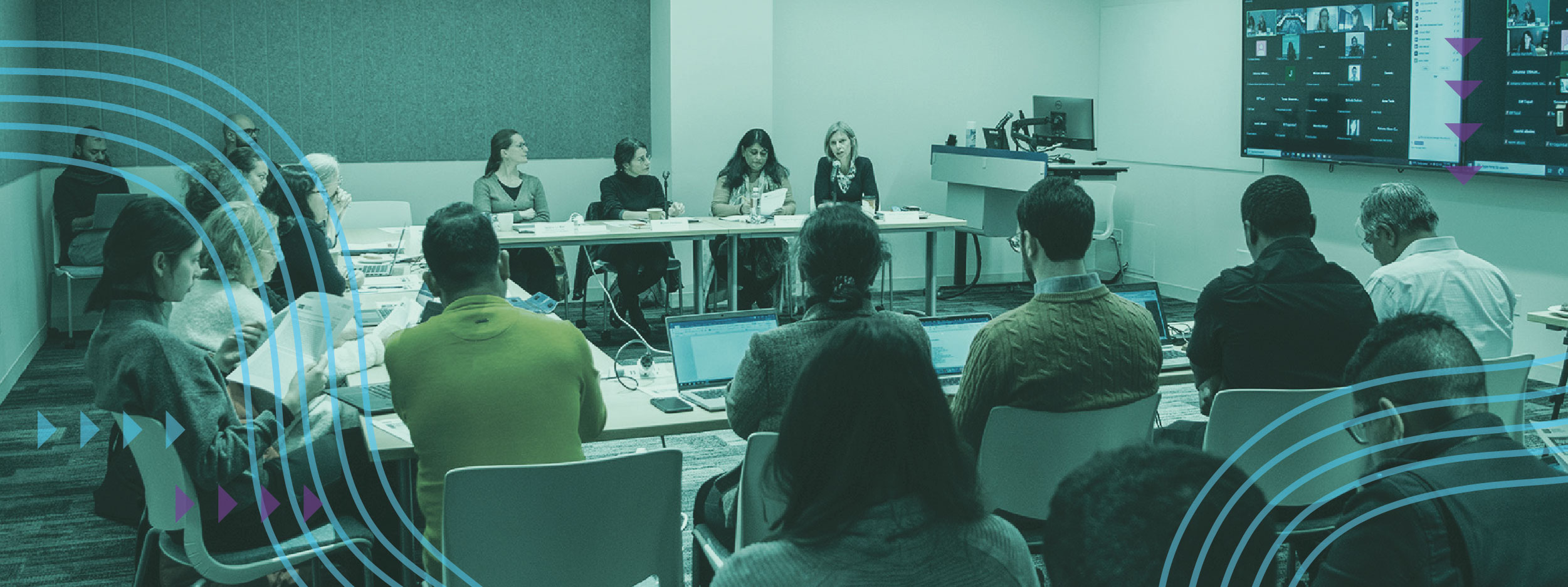 Anna Triandafyllidou speaking to a room of researchers